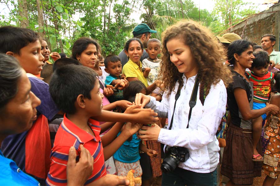 Tourists interact with local children in Sri Lanka 