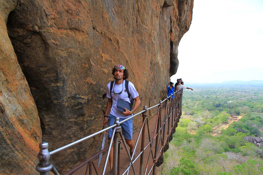 Climbing Sigiriya in their tuk tuk challenge in Sri Lanka 