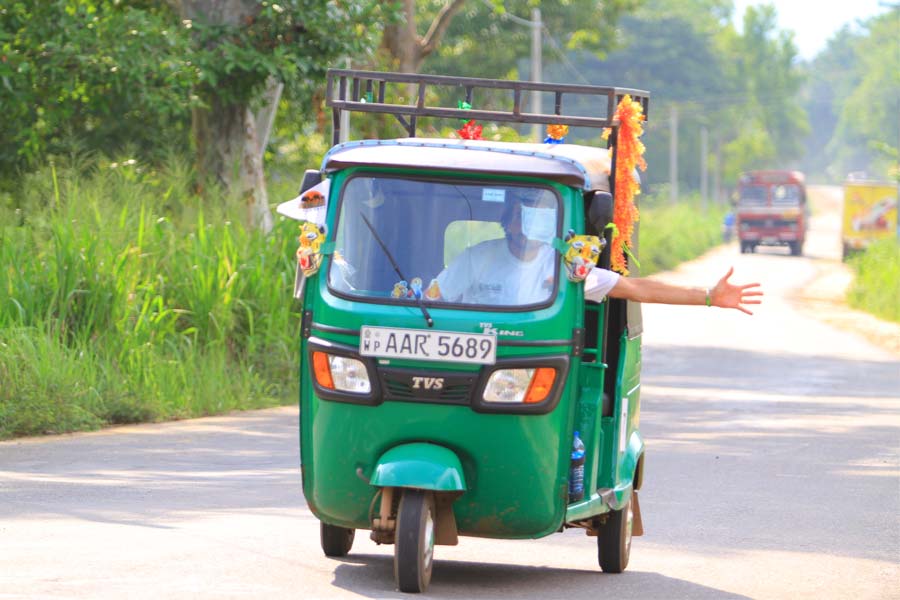 a tourist getting tuk tuk experiences in Sri Lanka 